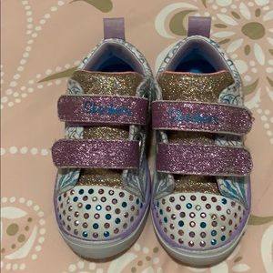 Toddler girl slightly used twinkle toes shoes.